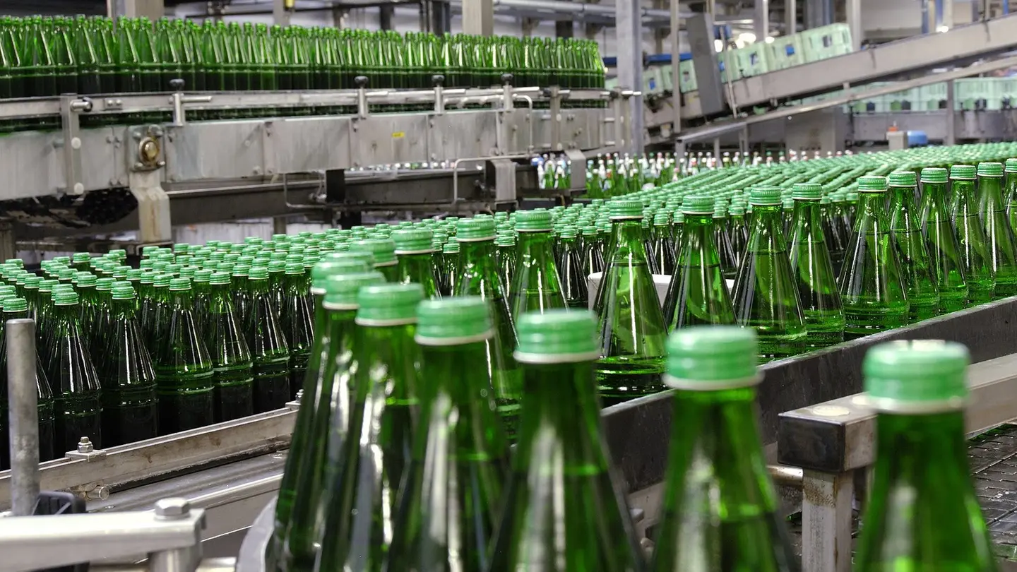 Bottles streaming down the conveyor
