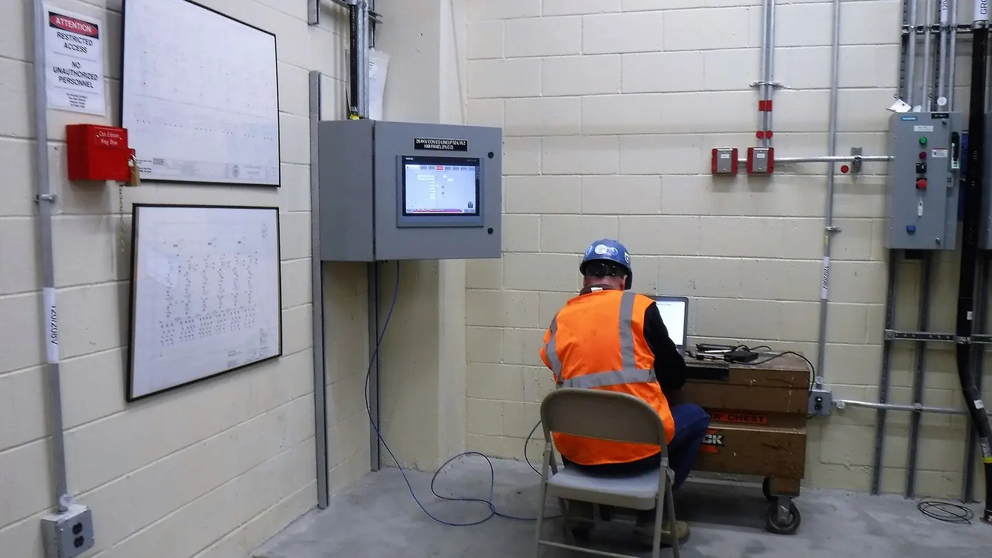 Specialist checking the first run from the switchgear room