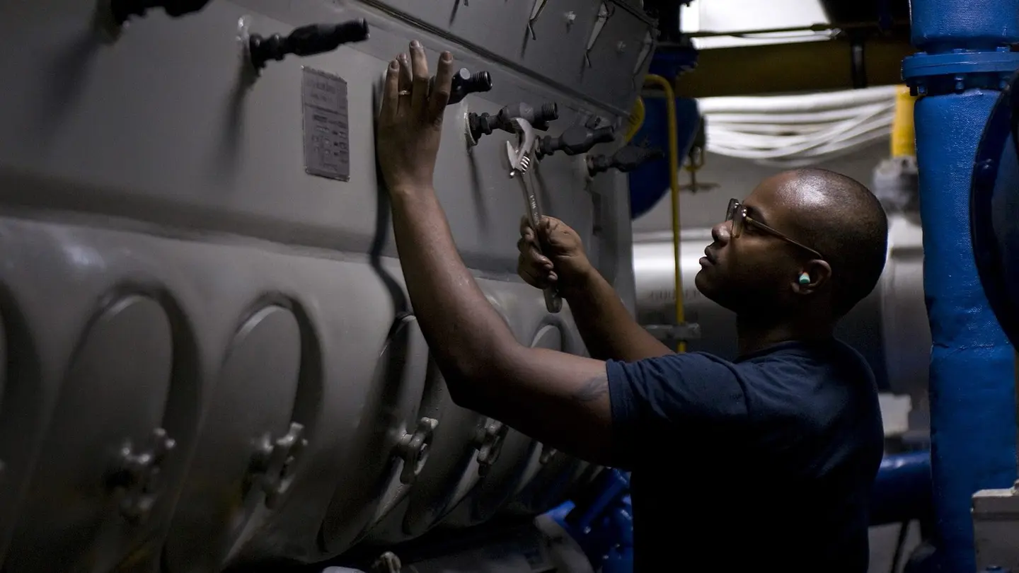 Crew member working on the generator